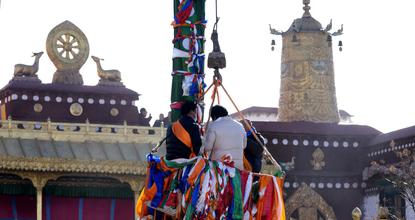 Prayer flag poles at Jokhang Temple renewed for Tibetan New Year
