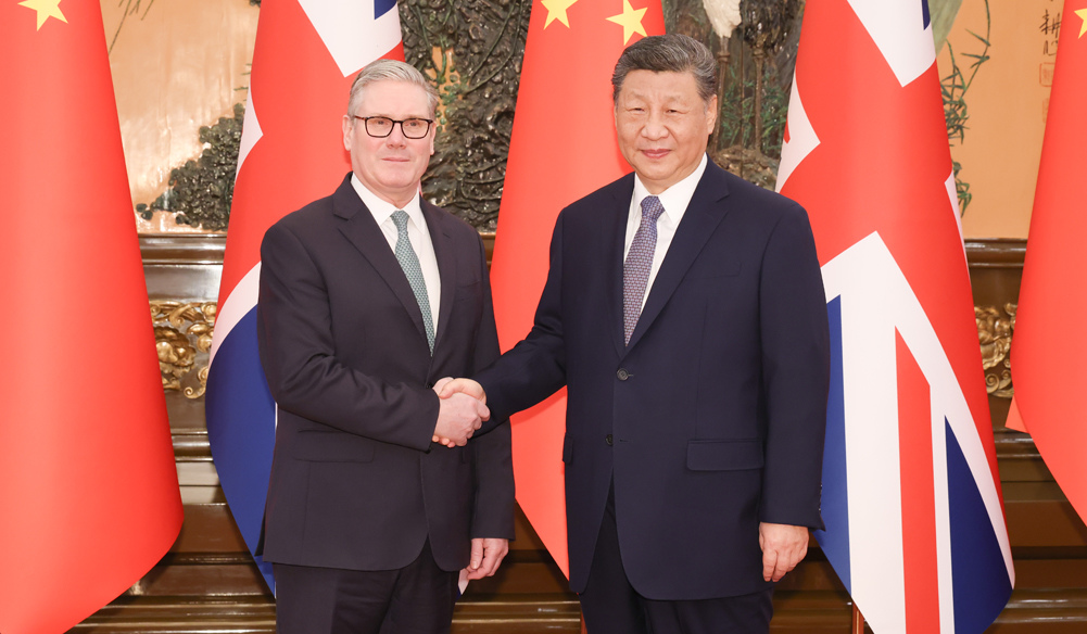 习近平会见英国首相斯塔默